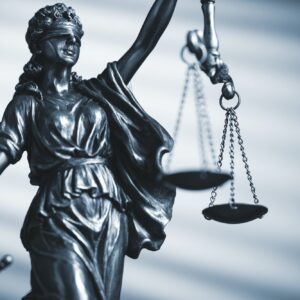 Figure of Justice holding scales and a sword
